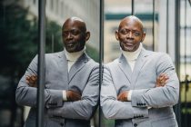 confident black man in grey suit